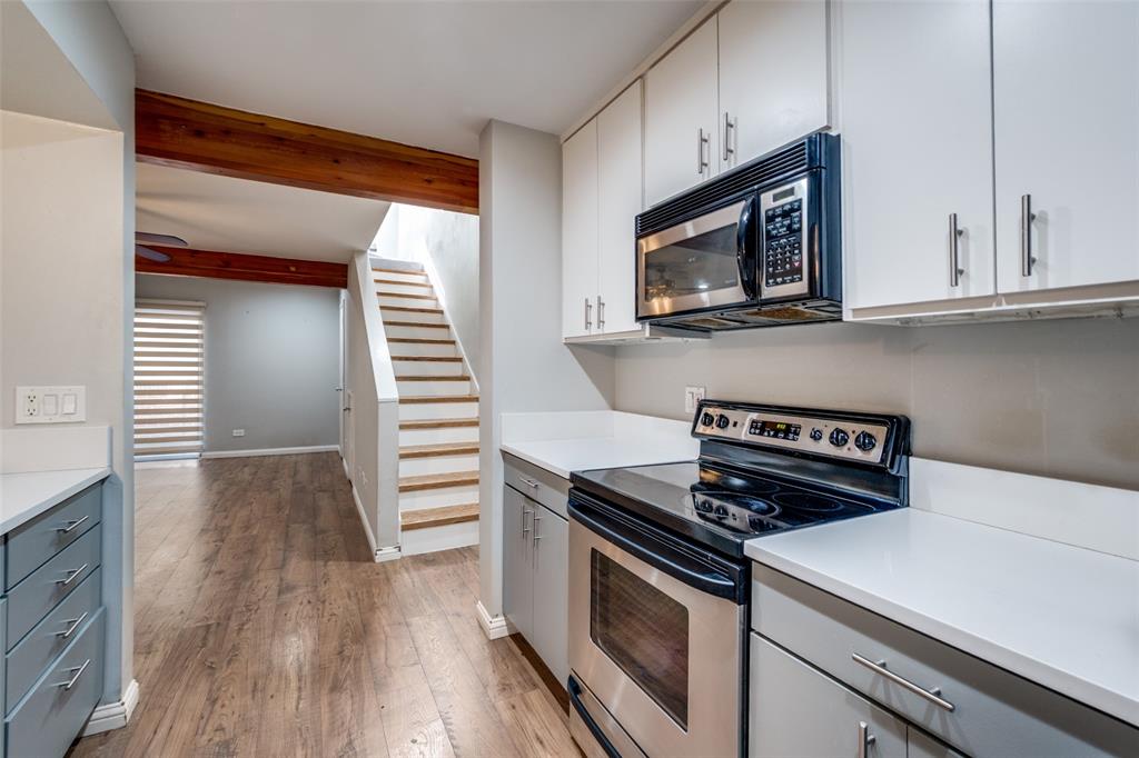 4231 Travis Street, Unit 20 Dallas, TX 75205 - Photo 7 of 23 a kitchen with cabinets and steel appliances
