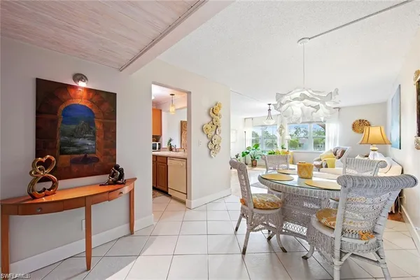 a kitchen with a sink a stove and cabinets