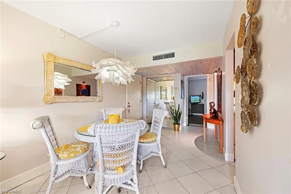 a view of kitchen with furniture and wooden floor