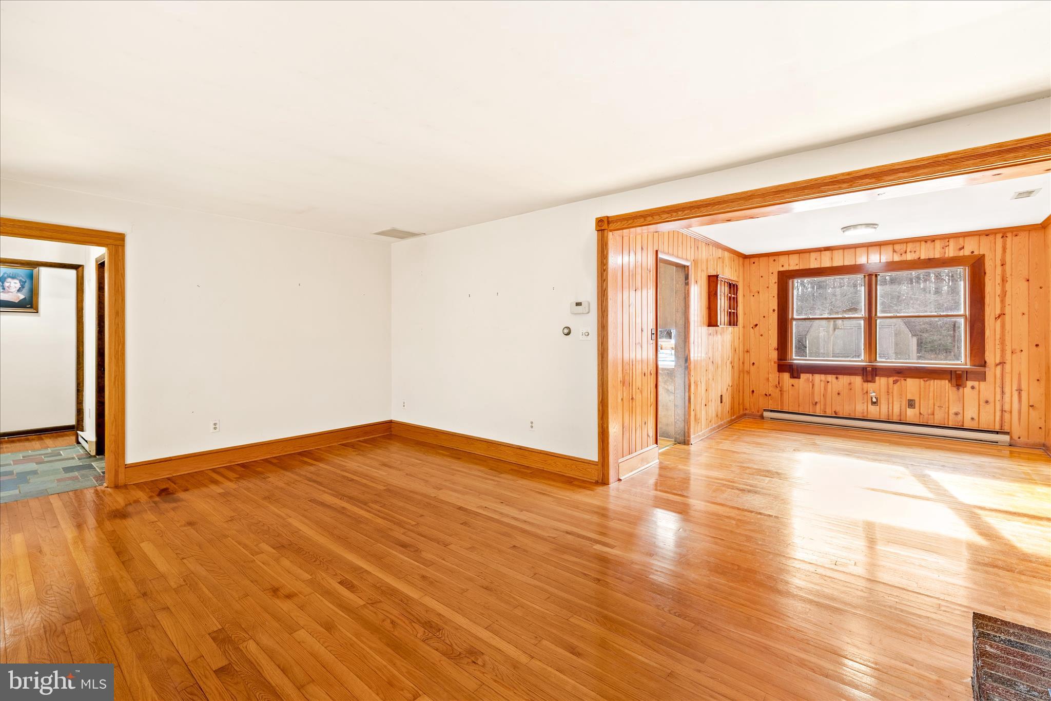 4170 Coulbourn Mill Road Salisbury, MD 21804 - Photo 12 of 47 an empty room with wooden floor and windows