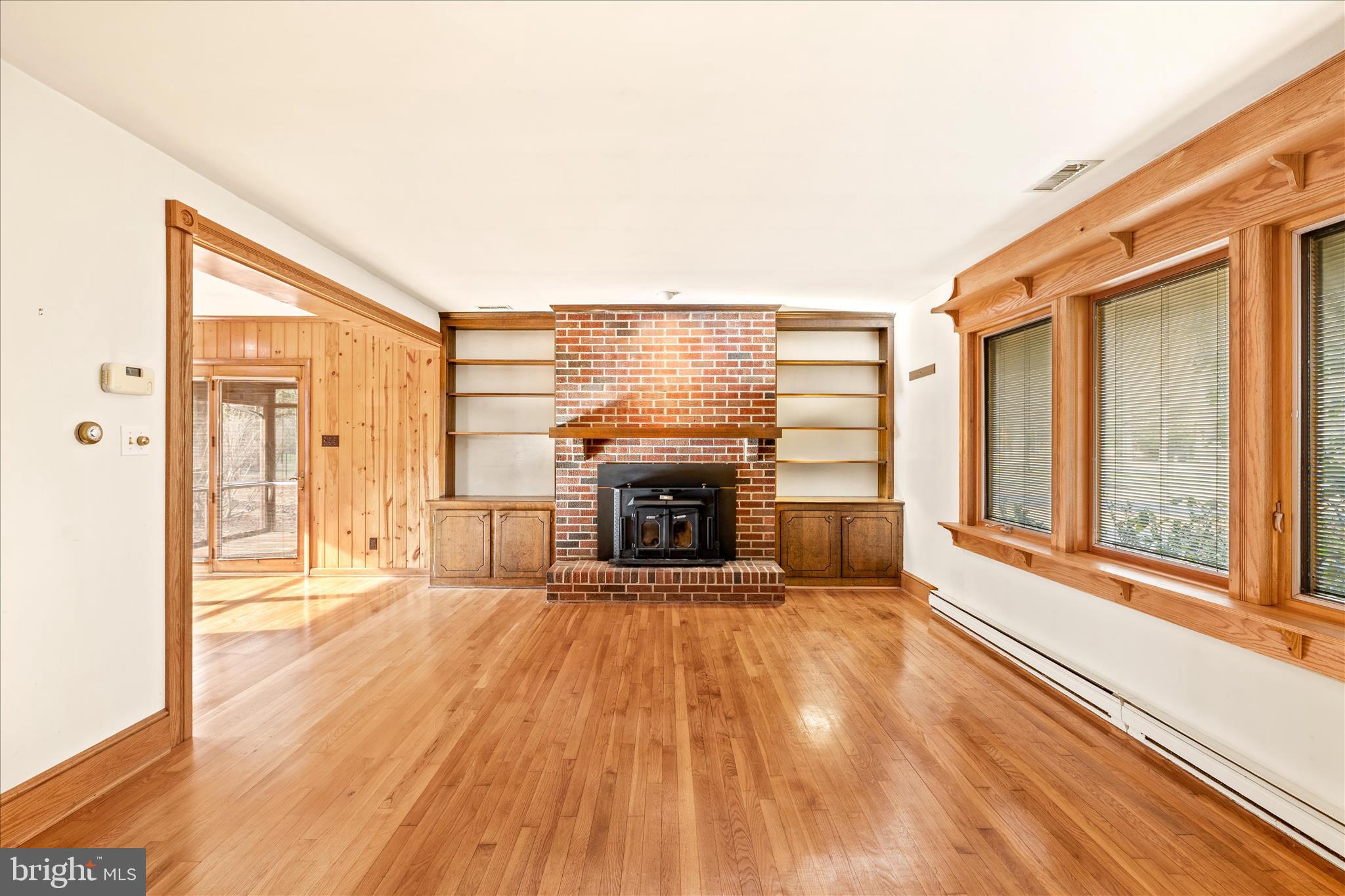 4170 Coulbourn Mill Road Salisbury, MD 21804 - Photo 13 of 47 a view of a livingroom with wooden floor and a fireplace