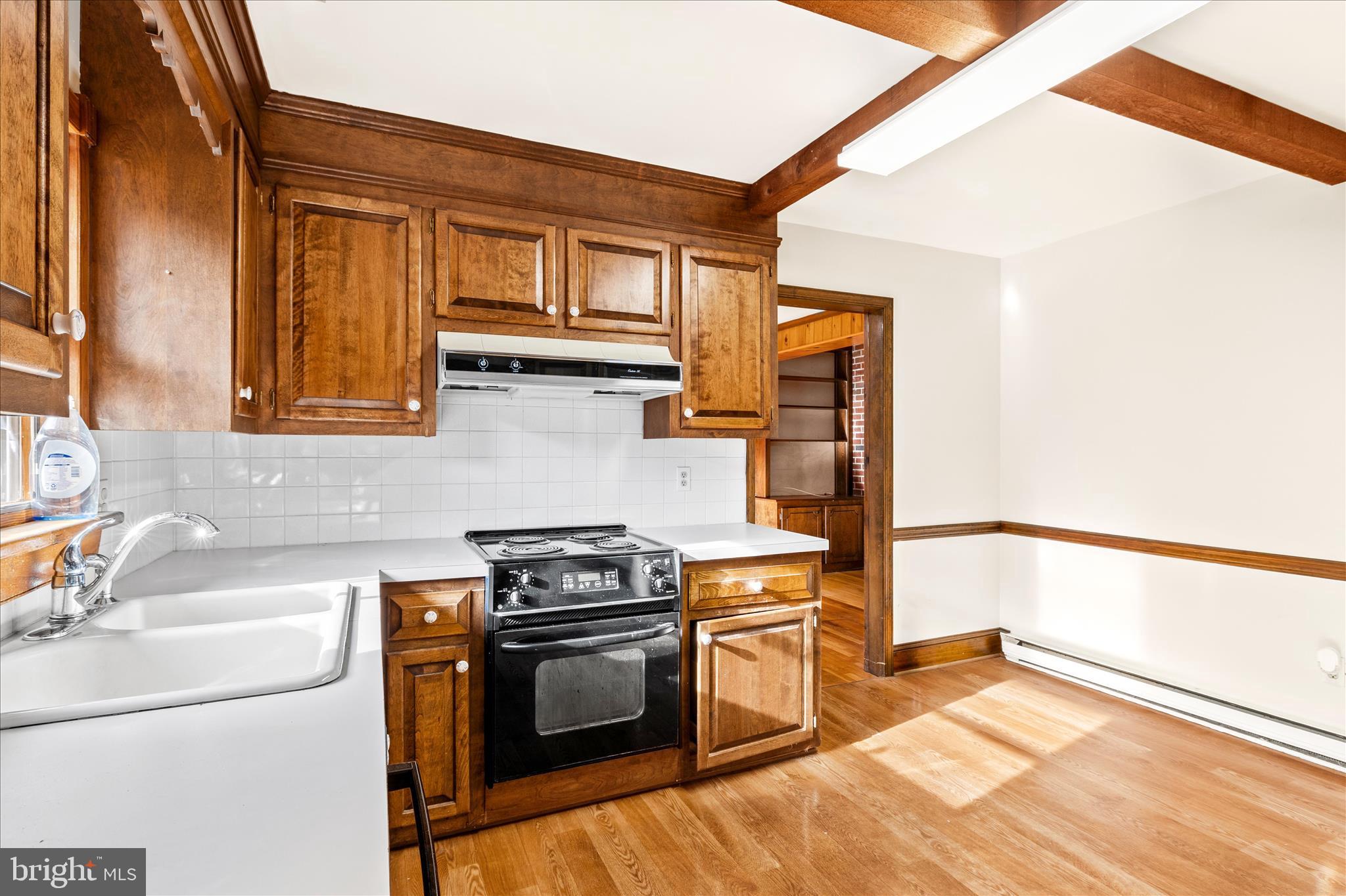 4170 Coulbourn Mill Road Salisbury, MD 21804 - Photo 18 of 47 a kitchen with a sink and a stove top oven