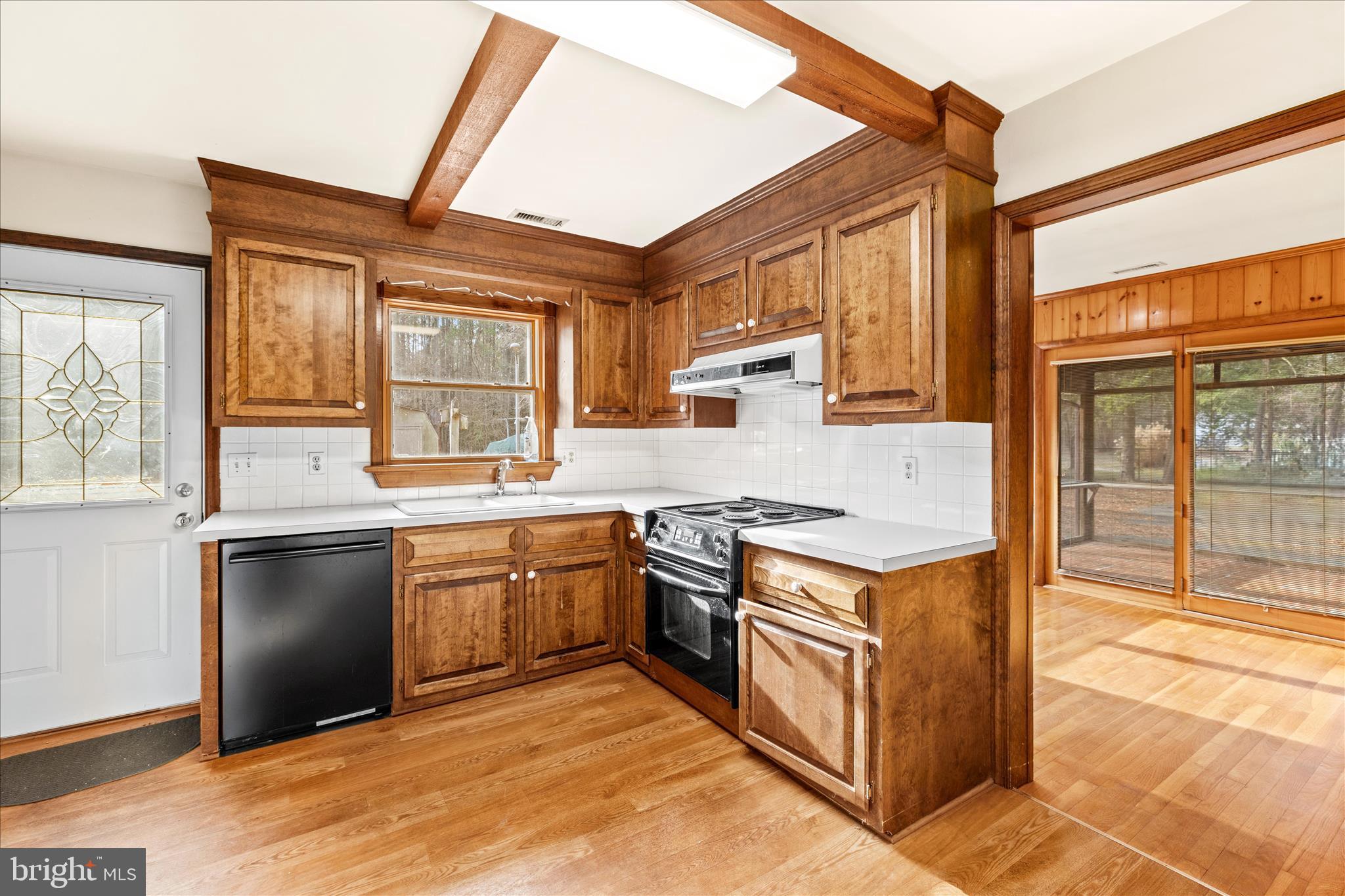 4170 Coulbourn Mill Road Salisbury, MD 21804 - Photo 19 of 47 a kitchen with stainless steel appliances granite countertop a stove a sink and a refrigerator