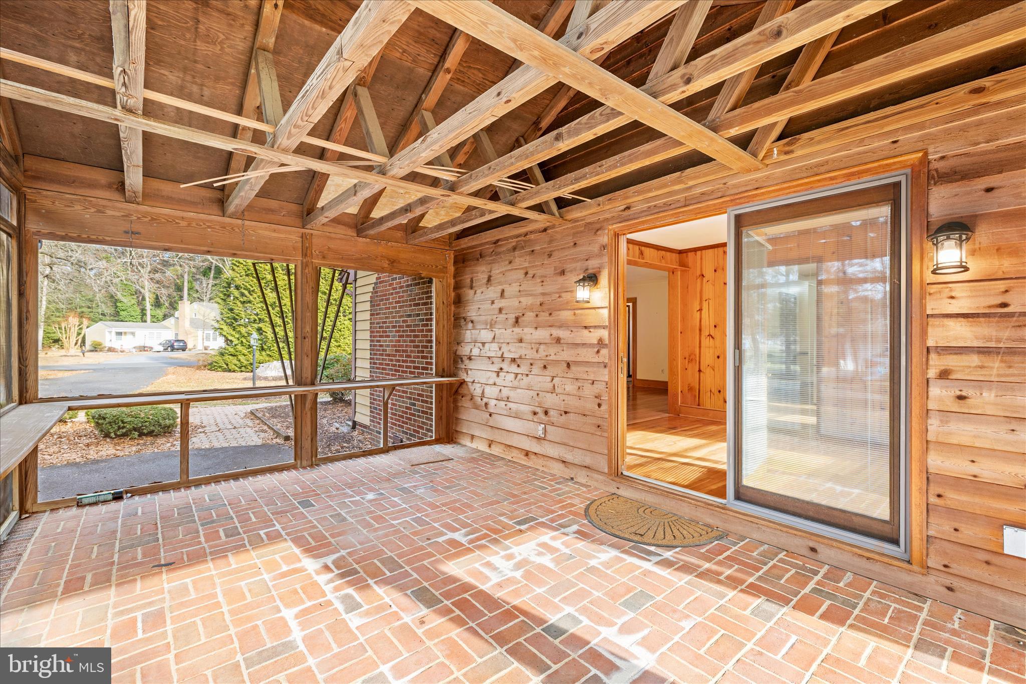 4170 Coulbourn Mill Road Salisbury, MD 21804 - Photo 21 of 47 a view of a porch with wooden floor and iron stairs