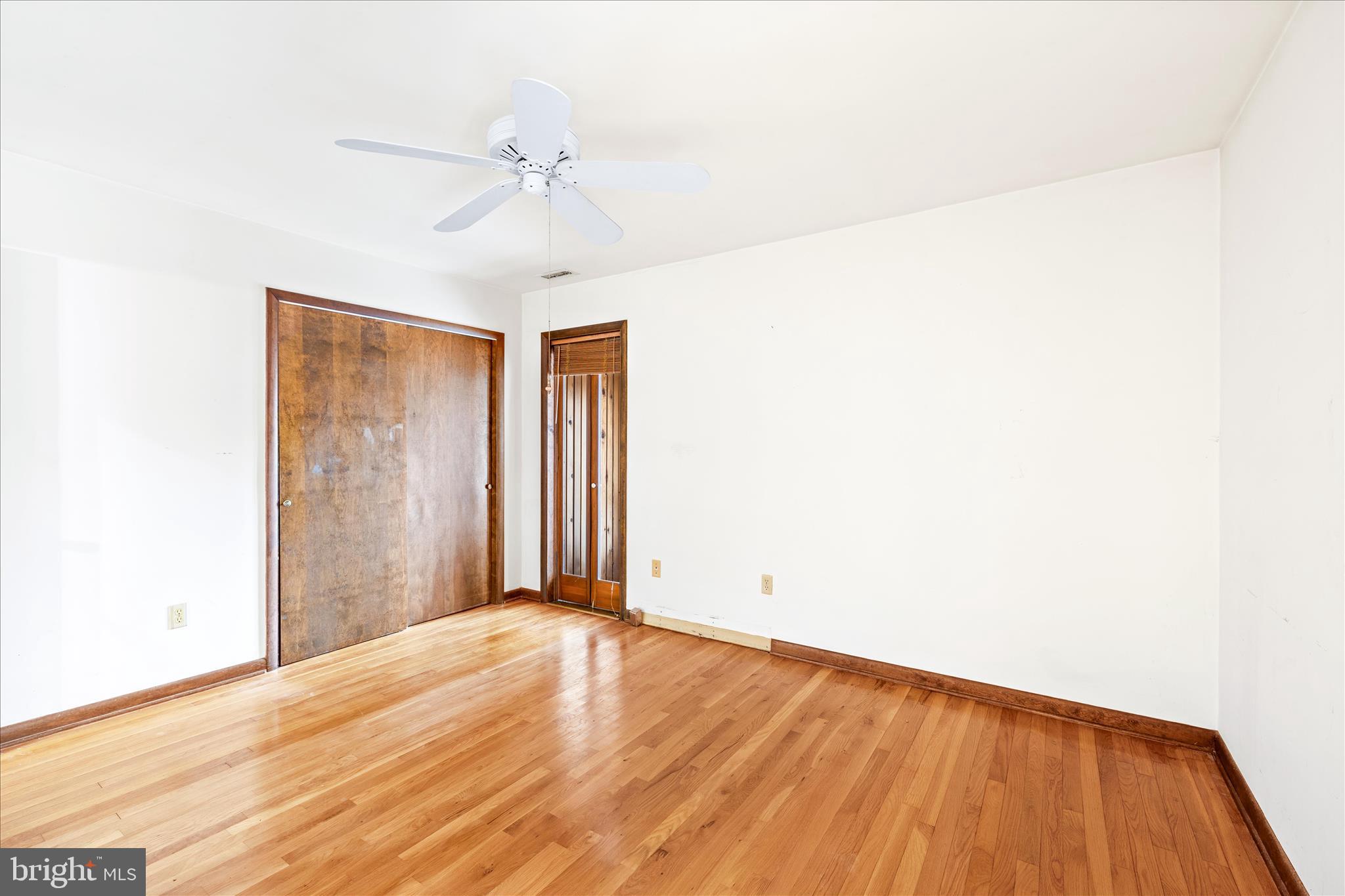 4170 Coulbourn Mill Road Salisbury, MD 21804 - Photo 26 of 47 a view of a room with wooden floor and a ceiling fan
