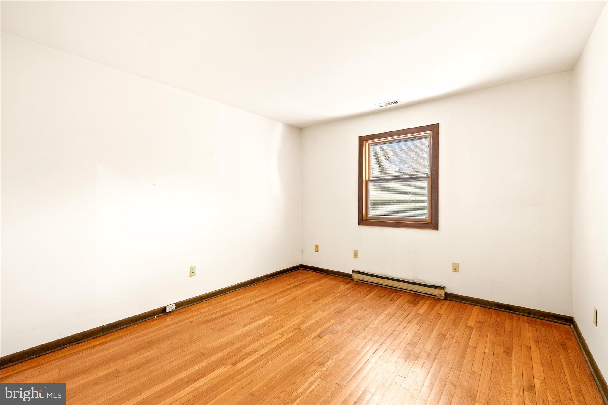 4170 Coulbourn Mill Road Salisbury, MD 21804 - Photo 32 of 47 an empty room with wooden floor and windows