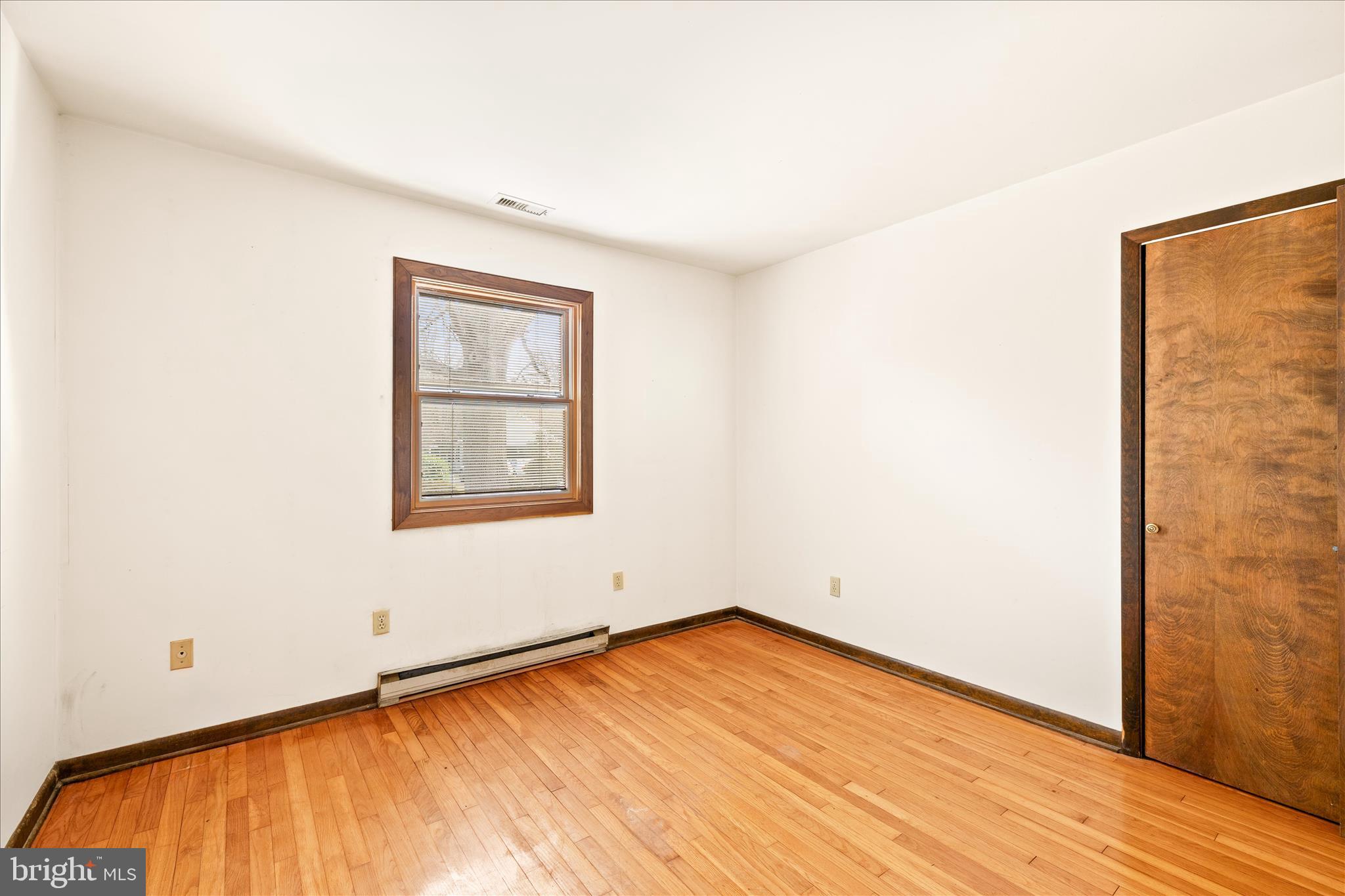 4170 Coulbourn Mill Road Salisbury, MD 21804 - Photo 33 of 47 an empty room with wooden floor and windows