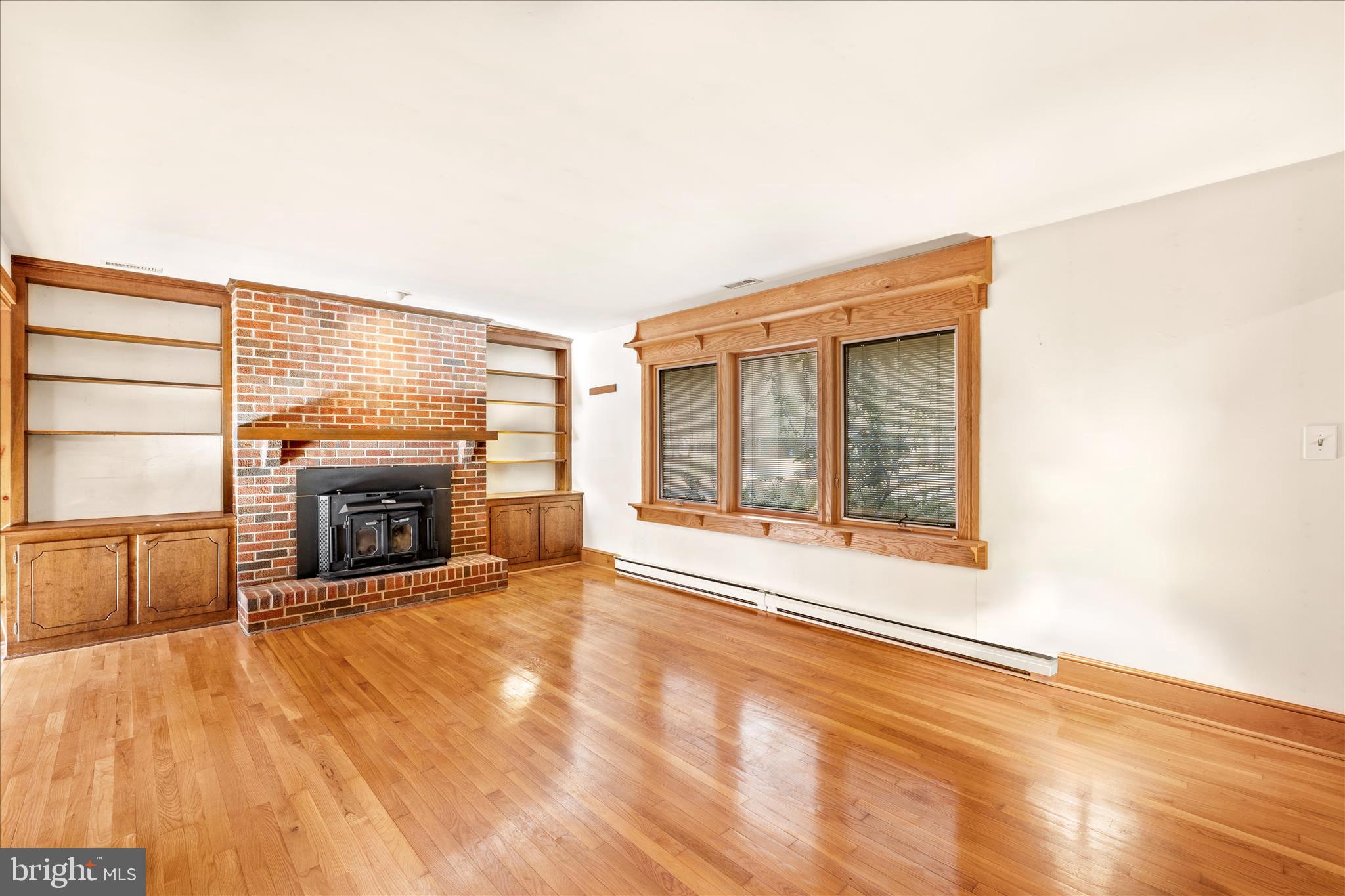4170 Coulbourn Mill Road Salisbury, MD 21804 - Photo 10 of 47 a view of an empty room with a fireplace and a window