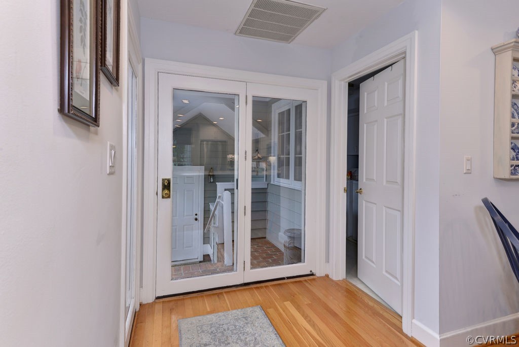 104 The Green Williamsburg, VA 23185 - Photo 13 of 50 a view of a hallway with wooden floor