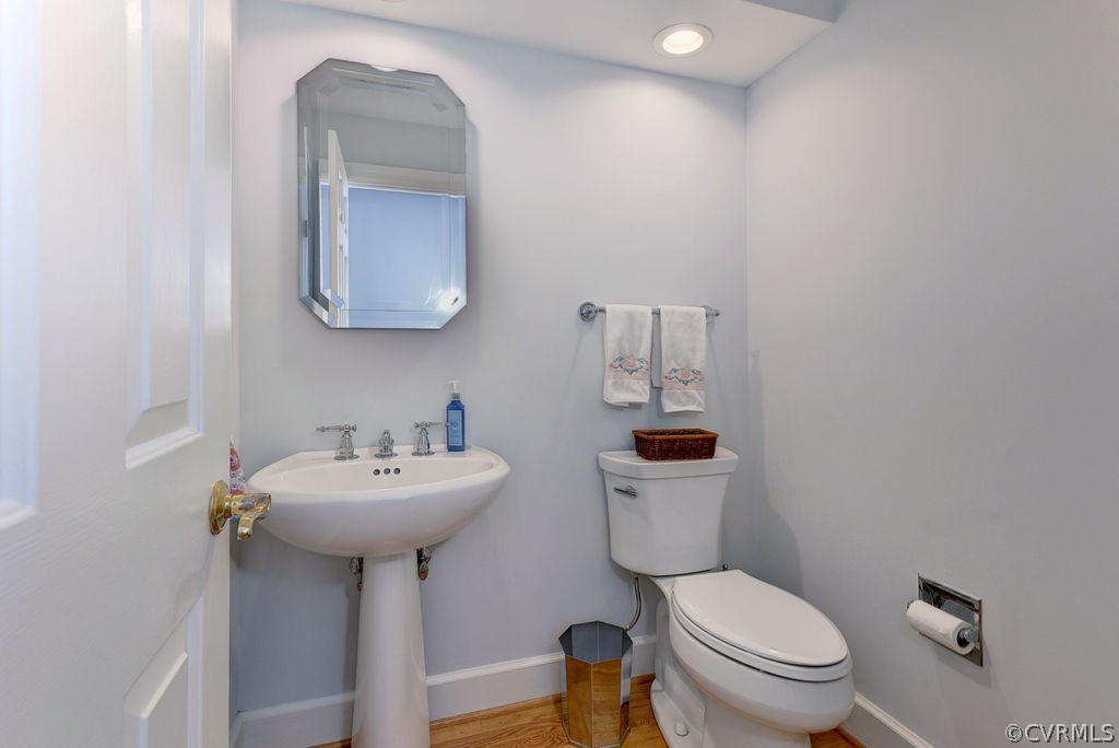 104 The Green Williamsburg, VA 23185 - Photo 17 of 50 a bathroom with a sink mirror and toilet