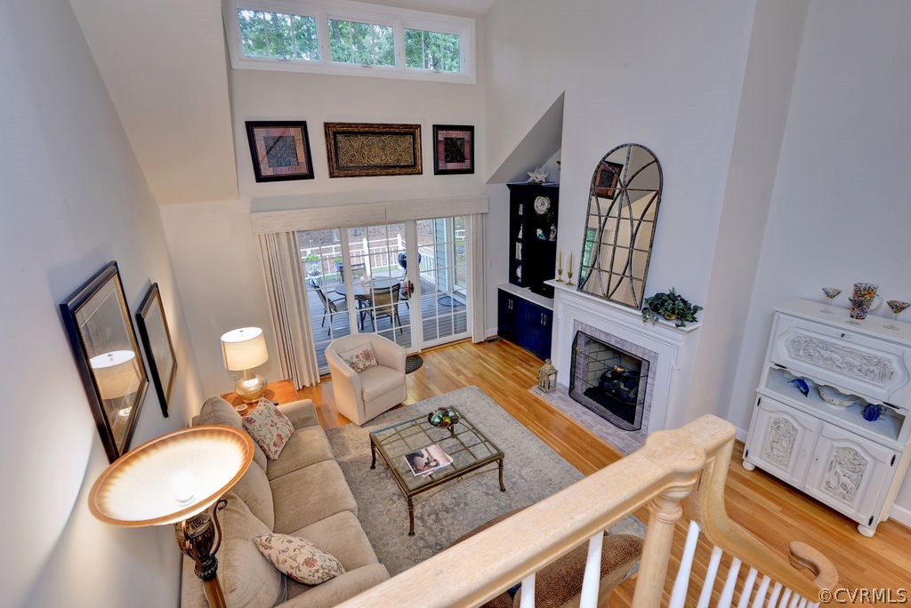 104 The Green Williamsburg, VA 23185 - Photo 20 of 50 a living room with furniture a fireplace and a flat screen tv