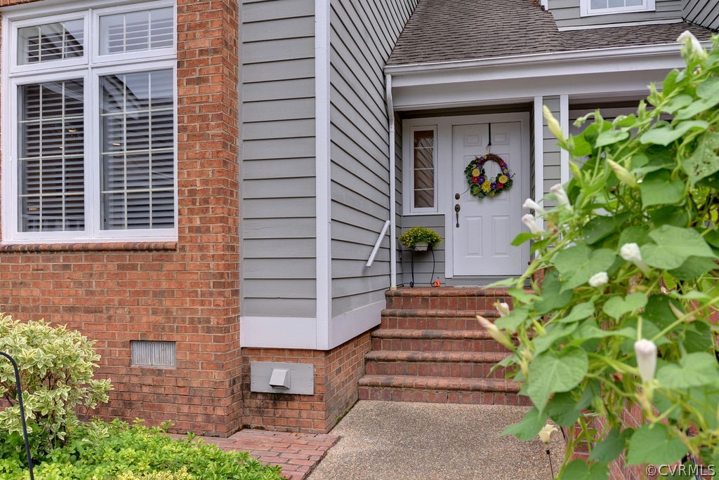 104 The Green Williamsburg, VA 23185 - Photo 2 of 50 a front view of a house with plants
