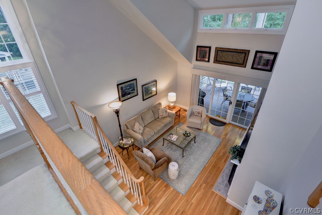 104 The Green Williamsburg, VA 23185 - Photo 21 of 50 a living room with furniture and a floor to ceiling window