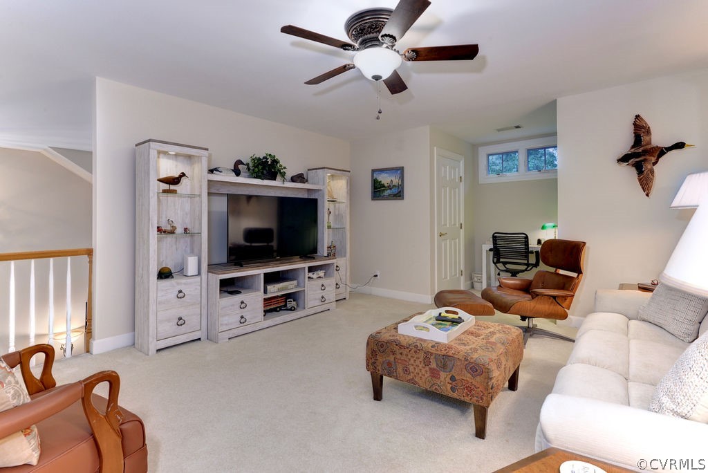 104 The Green Williamsburg, VA 23185 - Photo 23 of 50 a living room with furniture and a flat screen tv