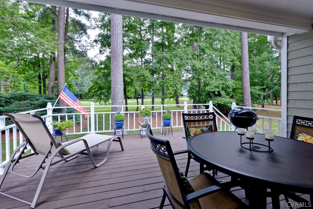 104 The Green Williamsburg, VA 23185 - Photo 30 of 50 a view of a patio with a table chairs and a table