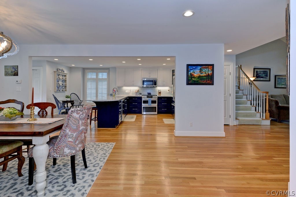 104 The Green Williamsburg, VA 23185 - Photo 4 of 50 a view of a dining room with furniture and wooden floor