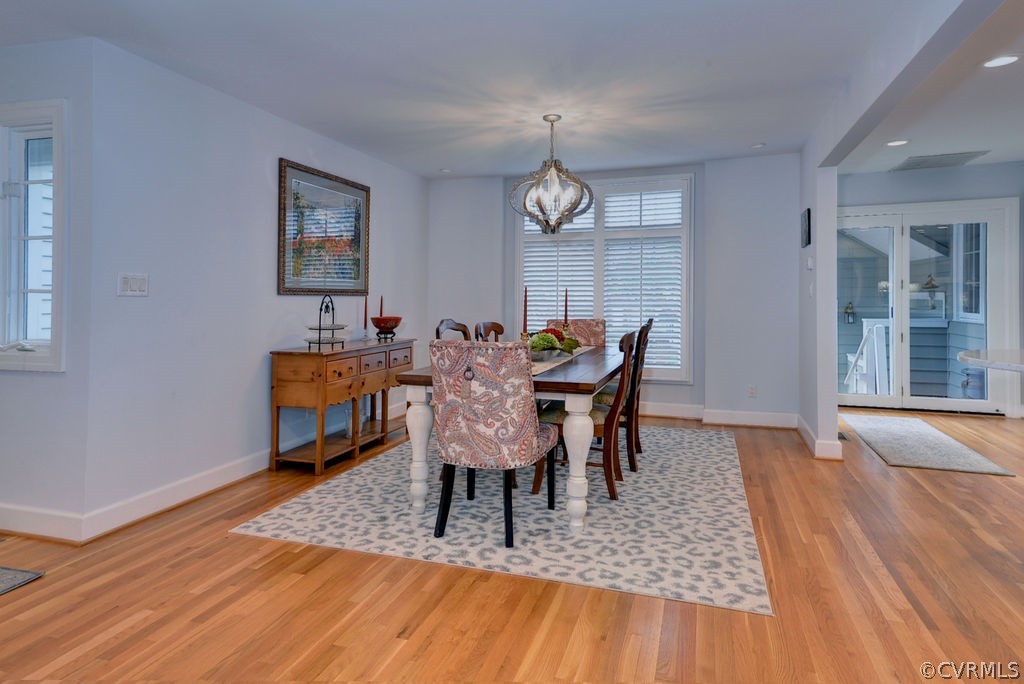 104 The Green Williamsburg, VA 23185 - Photo 5 of 50 a dining room with furniture a chandelier and wooden floor