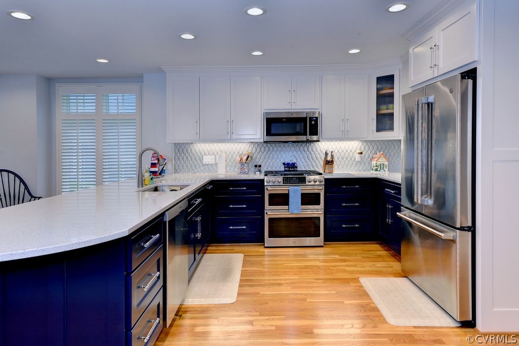 104 The Green Williamsburg, VA 23185 - Photo 8 of 50 a kitchen with stainless steel appliances granite countertop a refrigerator sink and stove