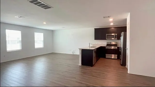 a house with swimming pool in front of it