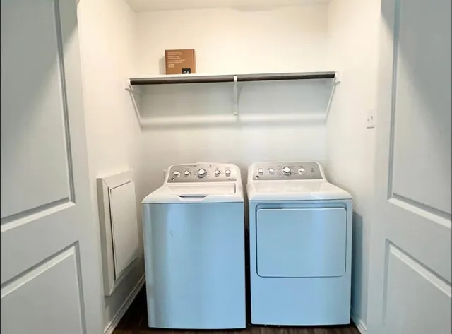 a view of kitchen with kitchen island and wooden floor