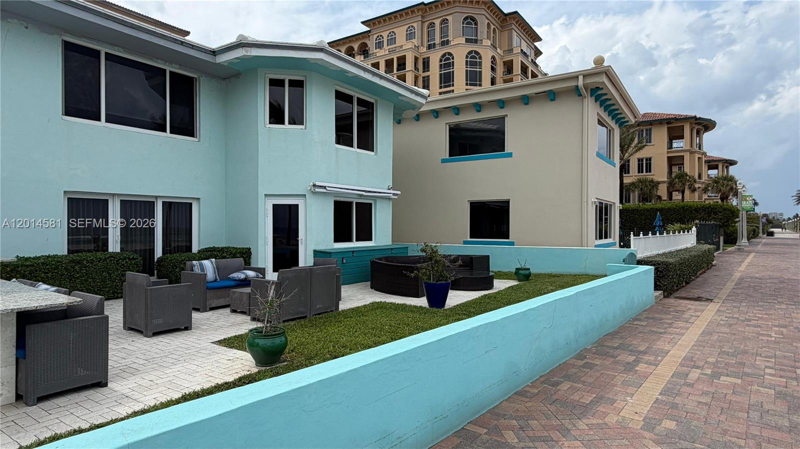 3400 North Surf Road, Unit 1 Hollywood, FL 33019 - Photo 4 of 14 a view of a house with couches in a patio