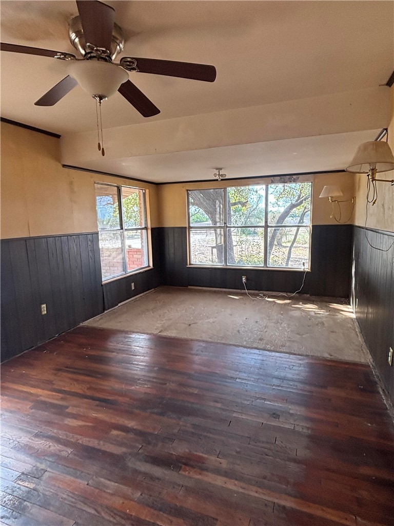 369 Edith Drive Alice, TX 78332 - Photo 21 of 27 a view of an empty room with a window and wooden floor