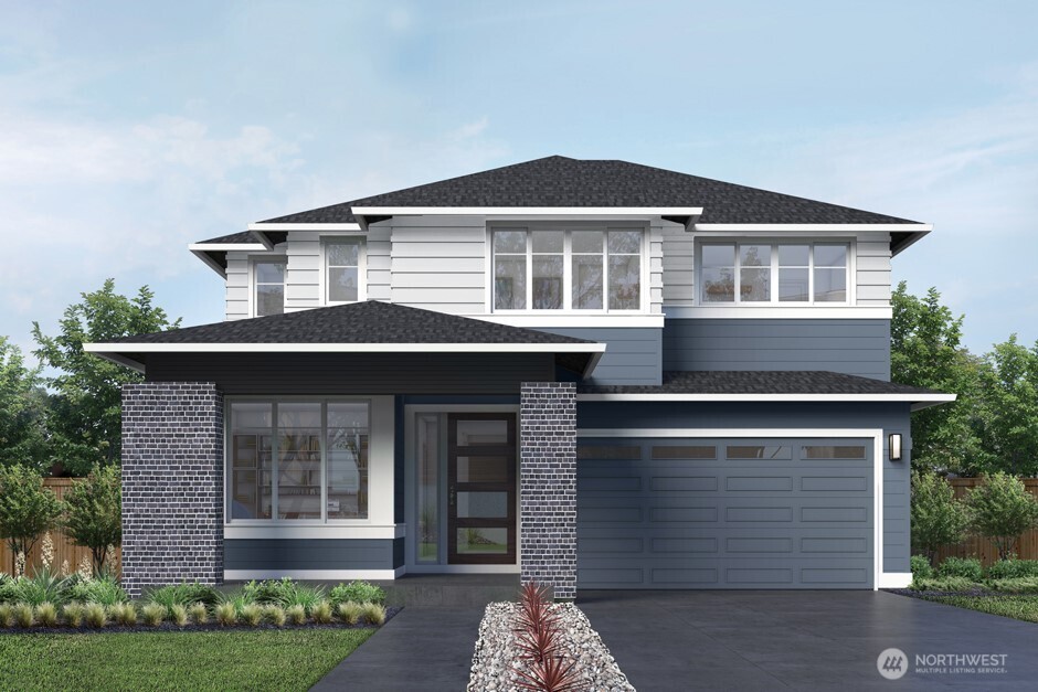 3924 199th Place Southeast Bothell, WA 98012 - Photo 1 of 12 a front view of a house with a garden