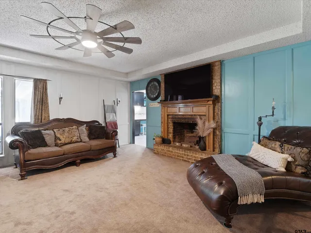 a bedroom with a bed and a fireplace