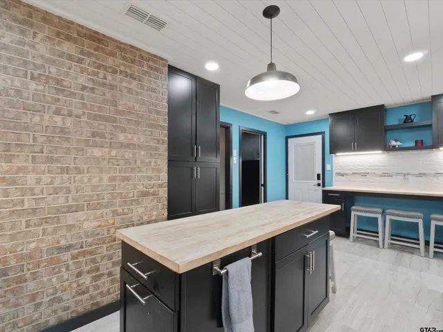 a kitchen with a cabinets a sink and counter space