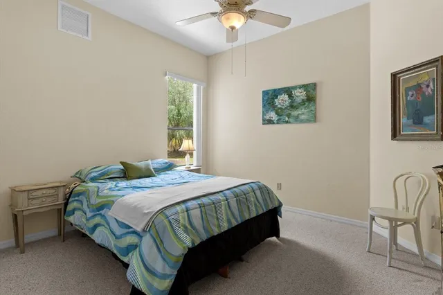 a bedroom with a bed and hallway