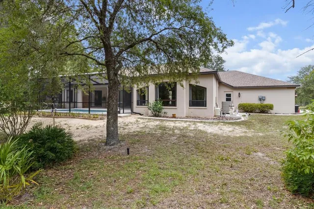 aerial view of a house with a garden