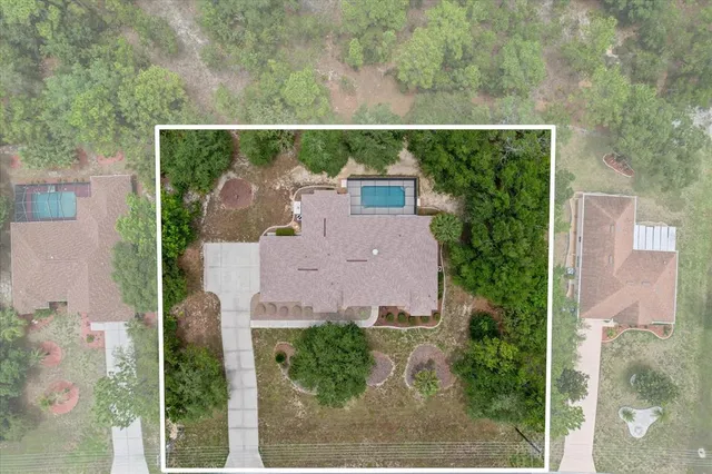 an aerial view of a house with yard and outdoor space