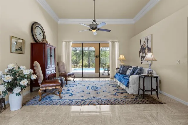 a living room with furniture a couch and wooden floor