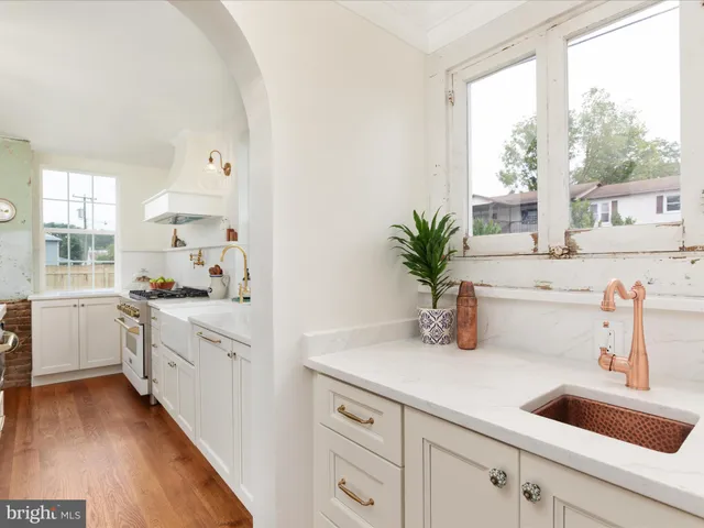 a view of an entryway with wooden floor and stairs
