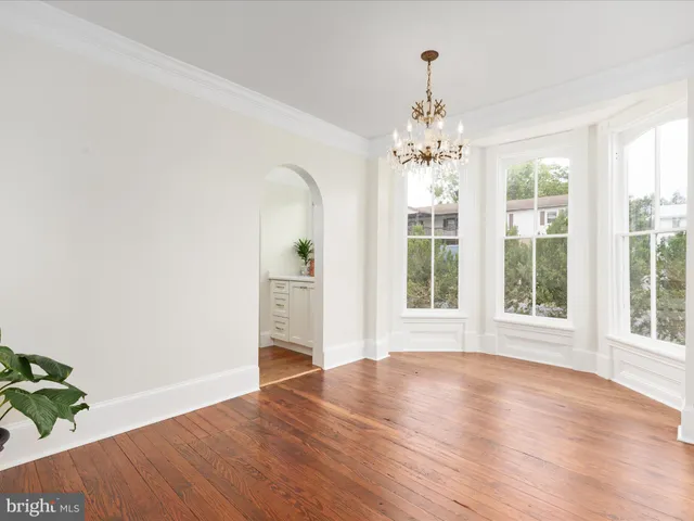 a bathroom with a toilet a sink and a mirror