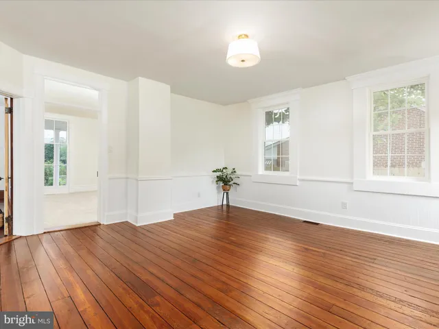 a spacious bathroom with a sink a mirror and a shower