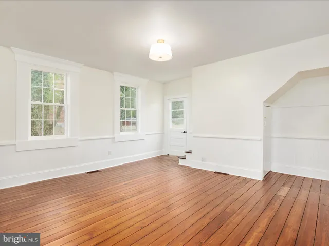a kitchen with a window sink and a window