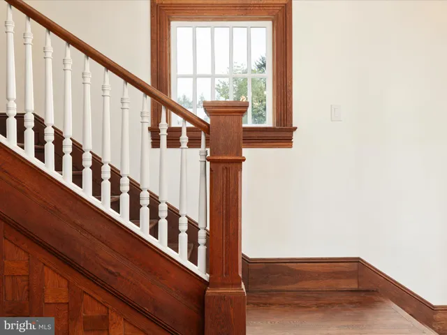 a bathroom with double vanity sinks and a mirror