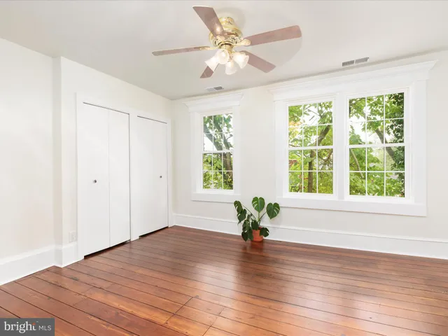 a backyard of a house with yard and outdoor seating