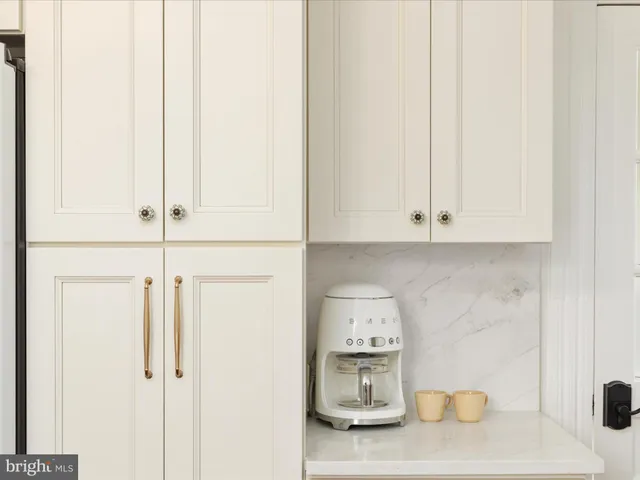 a bathroom with a sink a faucet and a mirror