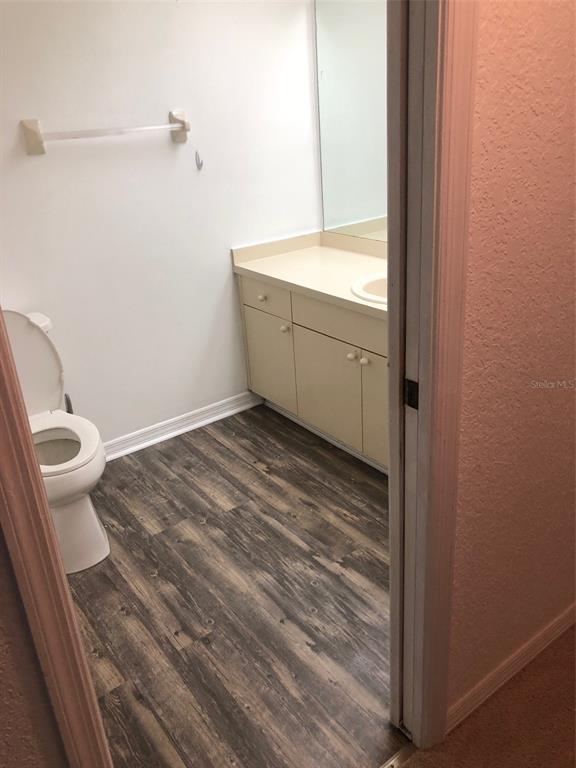 9720 Indian Key Trail, Unit 117 Seminole, FL 33776 - Photo 36 of 92 a bathroom with a sink and a toilet