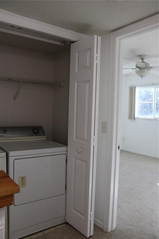 9720 Indian Key Trail, Unit 117 Seminole, FL 33776 - Photo 39 of 92 a view of storage and utility room with washer and dryer