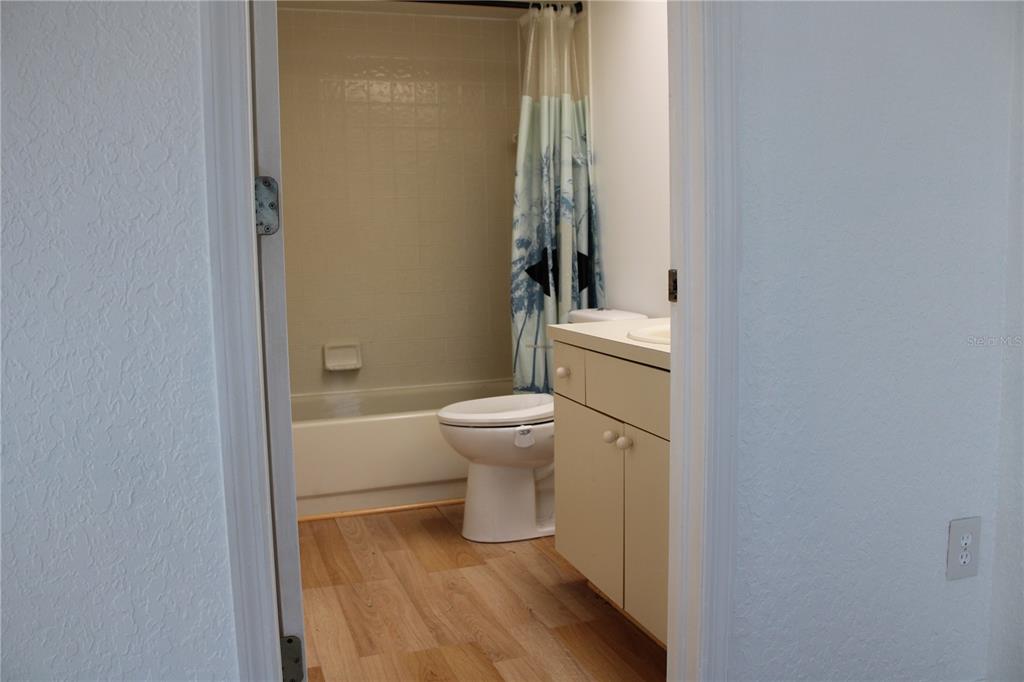 9720 Indian Key Trail, Unit 117 Seminole, FL 33776 - Photo 48 of 92 a bathroom with a toilet and a shower