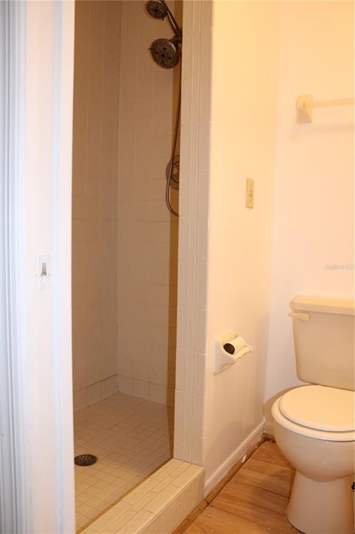9720 Indian Key Trail, Unit 117 Seminole, FL 33776 - Photo 66 of 92 a bathroom with a toilet and shower
