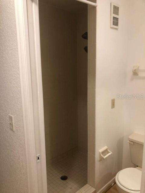 9720 Indian Key Trail, Unit 117 Seminole, FL 33776 - Photo 69 of 92 a white toilet sitting next to a shower