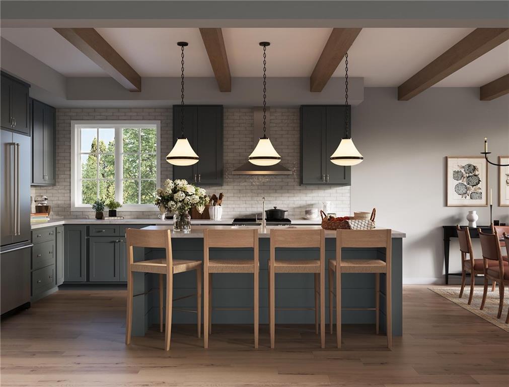 102 Ramsgate Road, Unit WARRINGTON Cranberry Township, PA 16066 - Photo 23 of 42 a kitchen with stainless steel appliances kitchen island granite countertop a table chairs sink and cabinets