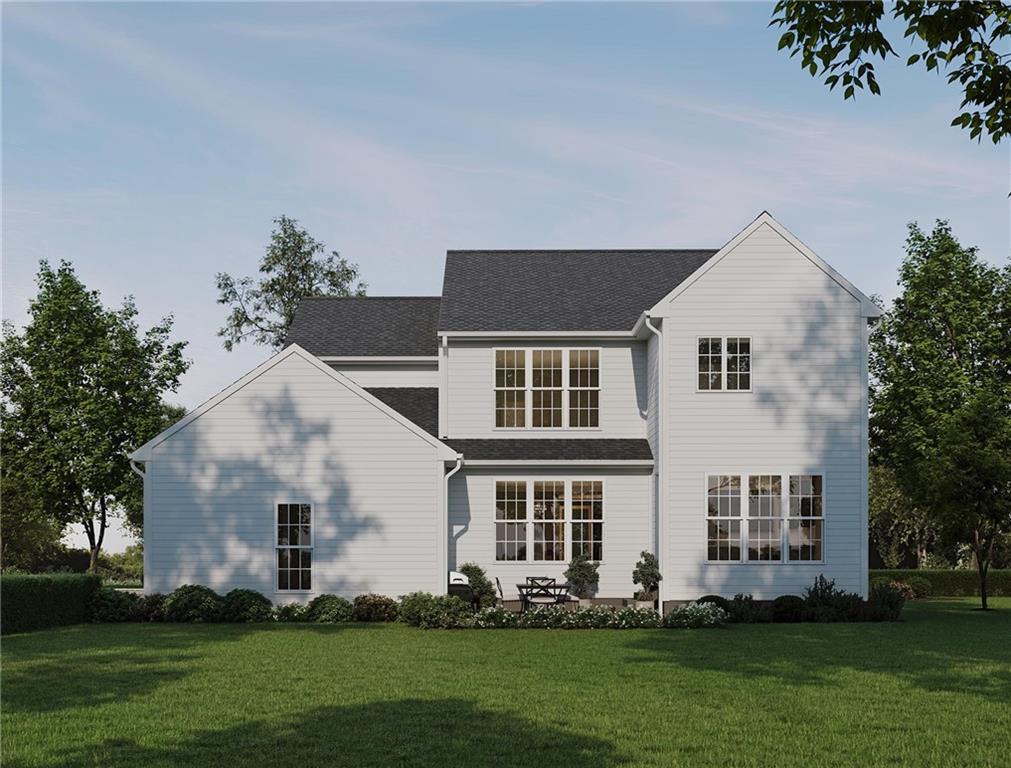 102 Ramsgate Road, Unit WARRINGTON Cranberry Township, PA 16066 - Photo 34 of 42 a front view of a house with a garden and trees