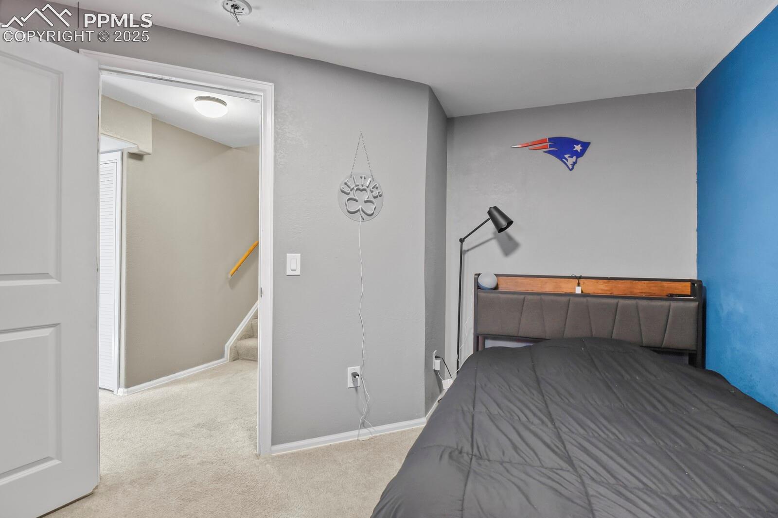 7660 Bullet Road Peyton, CO 80831 - Photo 34 of 50 Bedroom with light colored carpet and baseboards