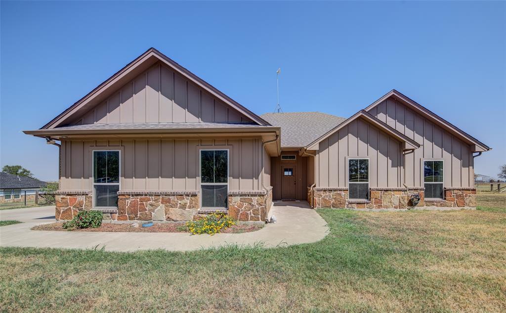 148 County Road 2830 Decatur, TX 76234 - Photo 1 of 38 Front of home With stone and board and batten siding.