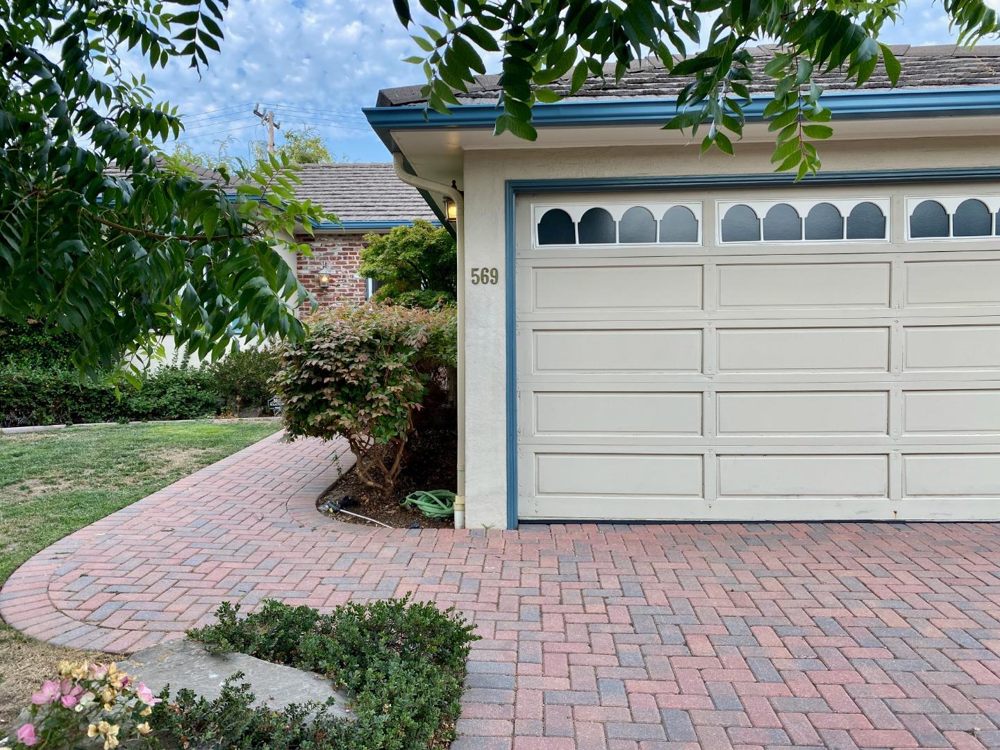569 Alhambra Road San Mateo, CA 94402 - Photo 3 of 30 a front view of a house with a yard